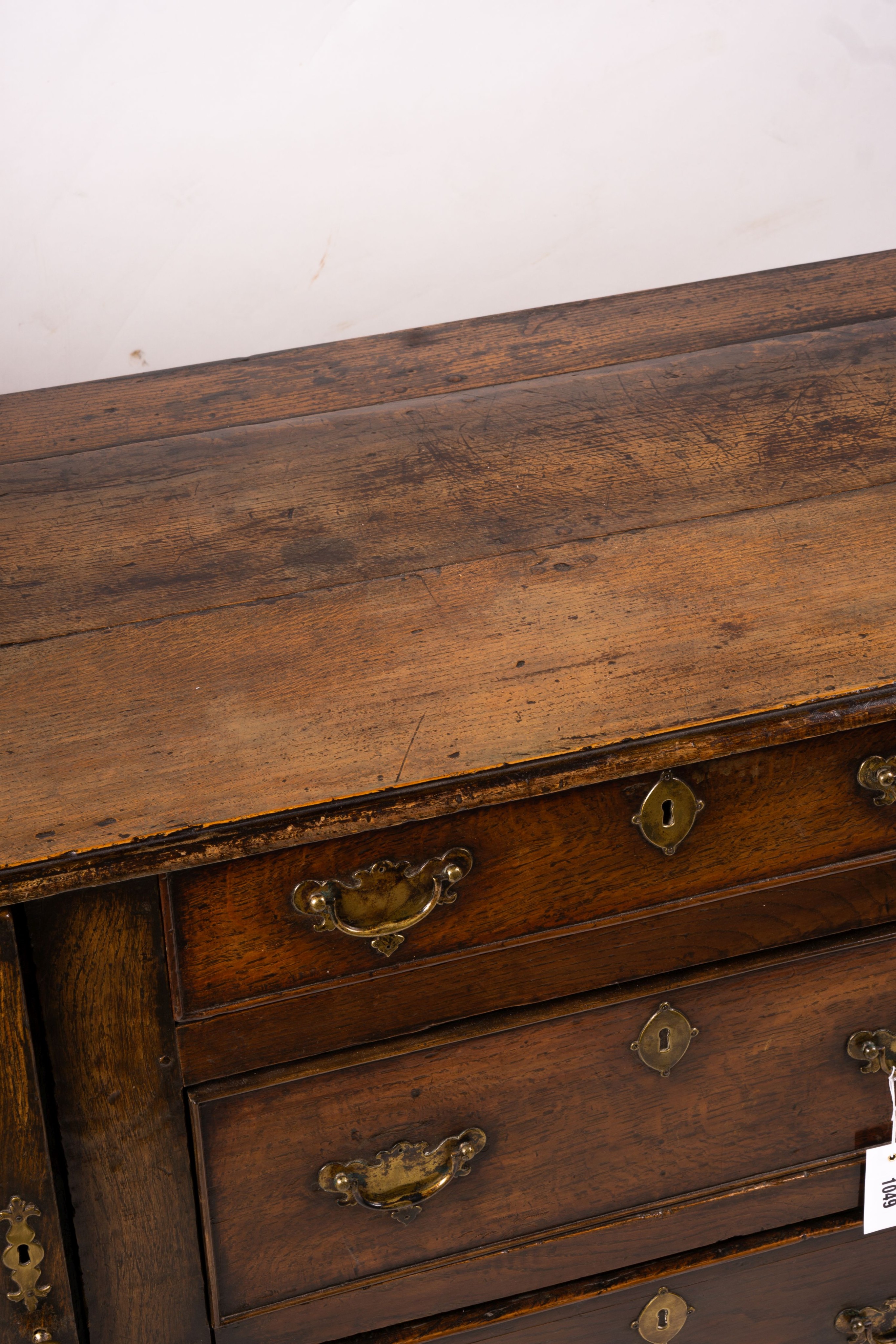 An 18th century oak low dresser base, length 191cm, depth 56cm, height 78cm